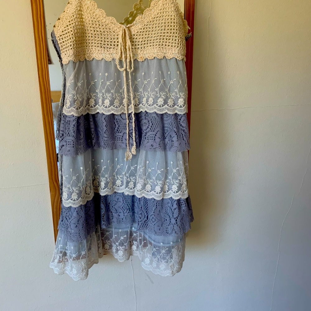 Boho, lace and crochet mini dress. No tags, but fits like a small/medium.